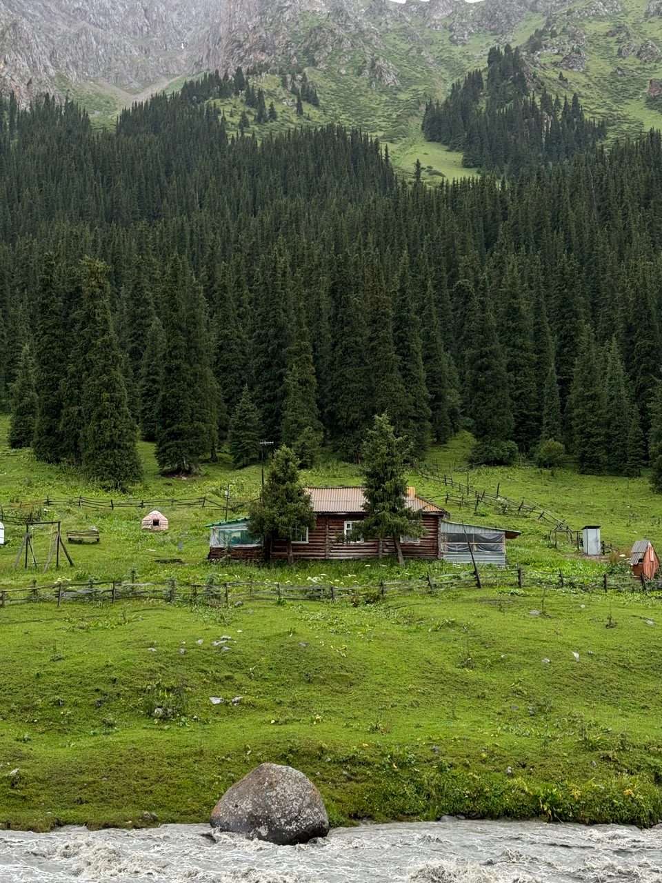 Altyn-Arashan landscape with mountain slopes.