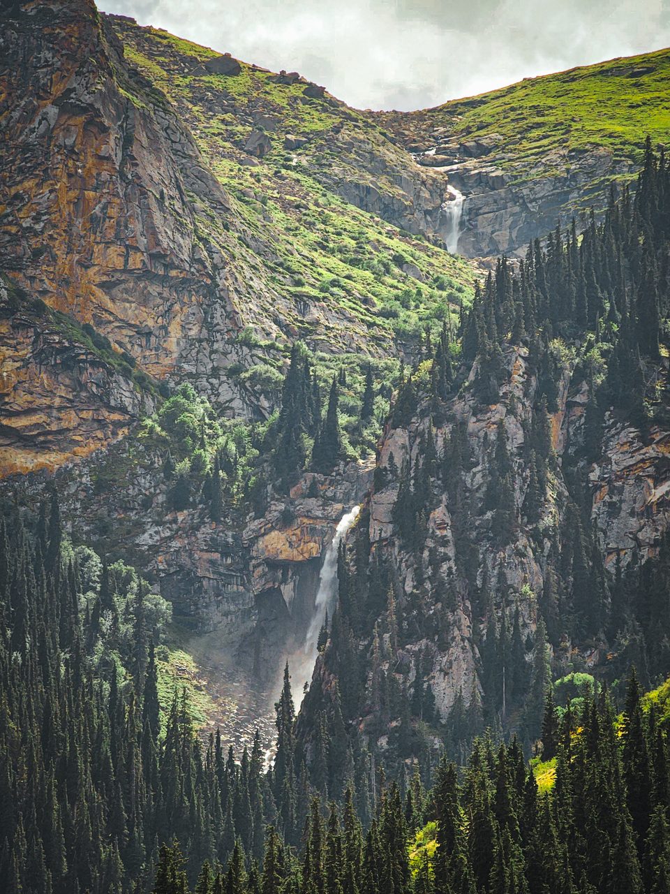 Upper and lower cascades cut through the rocky Barskoon Gorge.