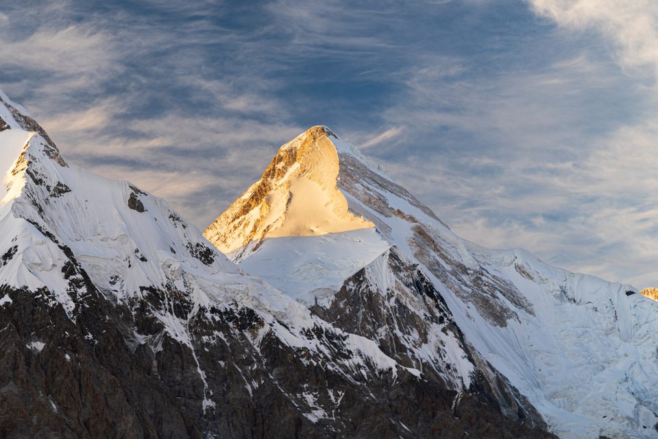 Khan Tengri above the Southern Inylchek Glacier at golden hour.